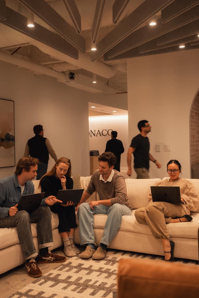 Four of the team working from the couch